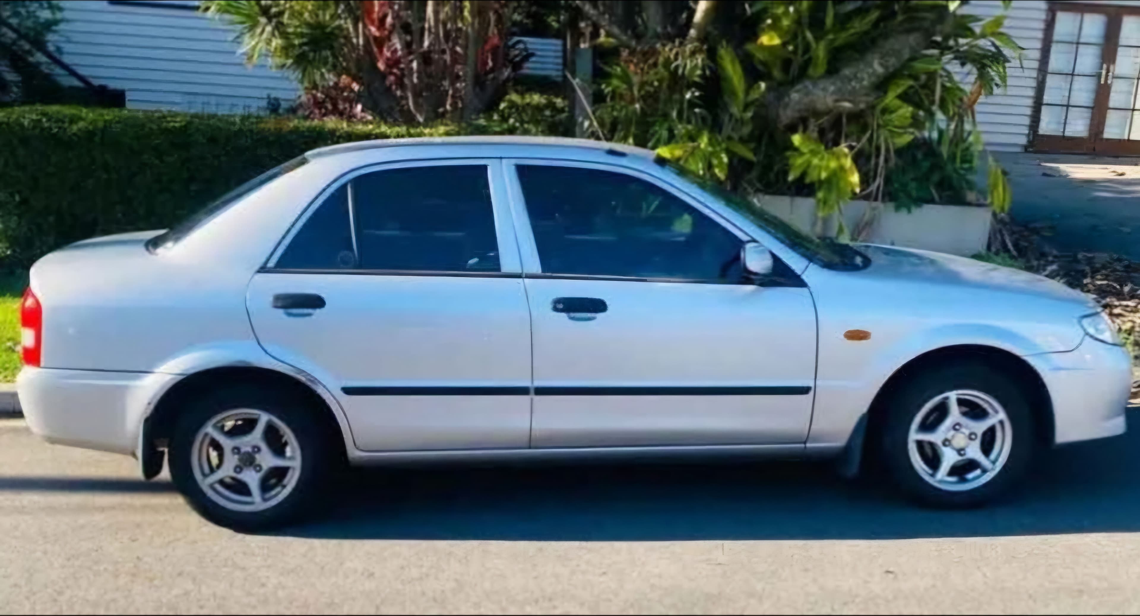 Mazda 323 sedan available to hire from Hive Drive